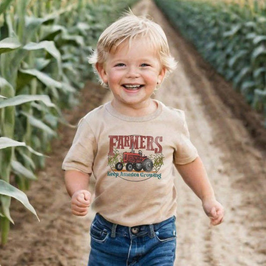 "Farmers keep America growing" Beige Toddler/Youth Tee. Red tractor