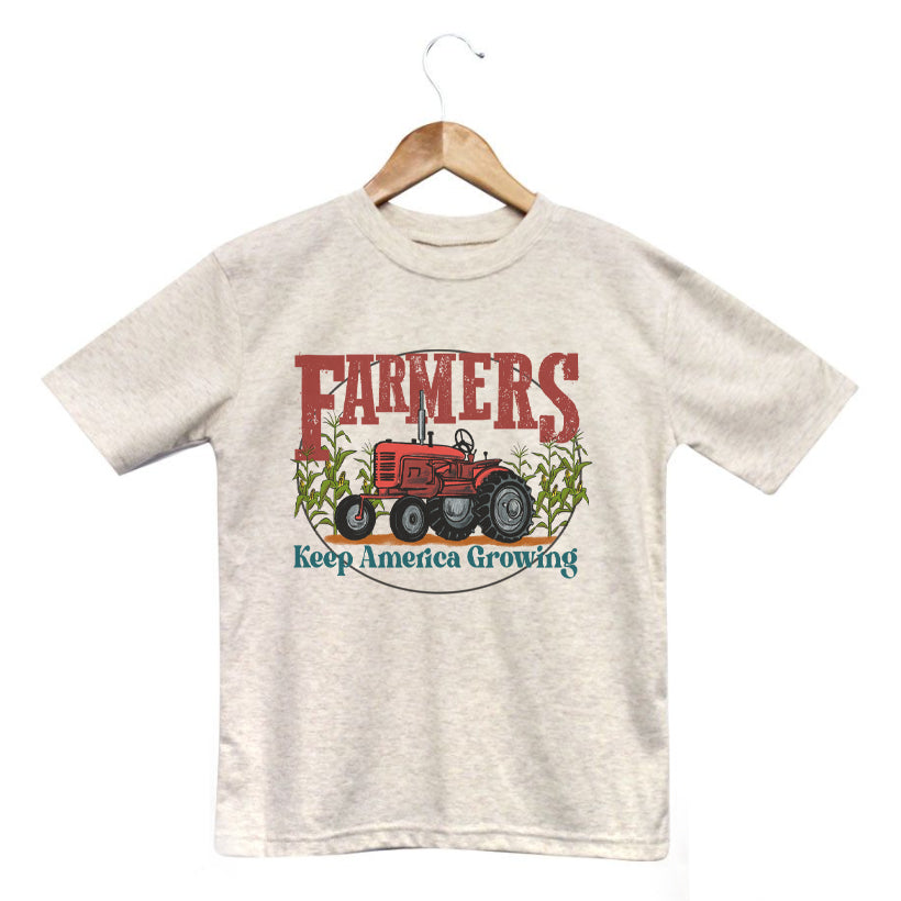 "Farmers keep America growing" Beige Toddler/Youth Tee. Red tractor