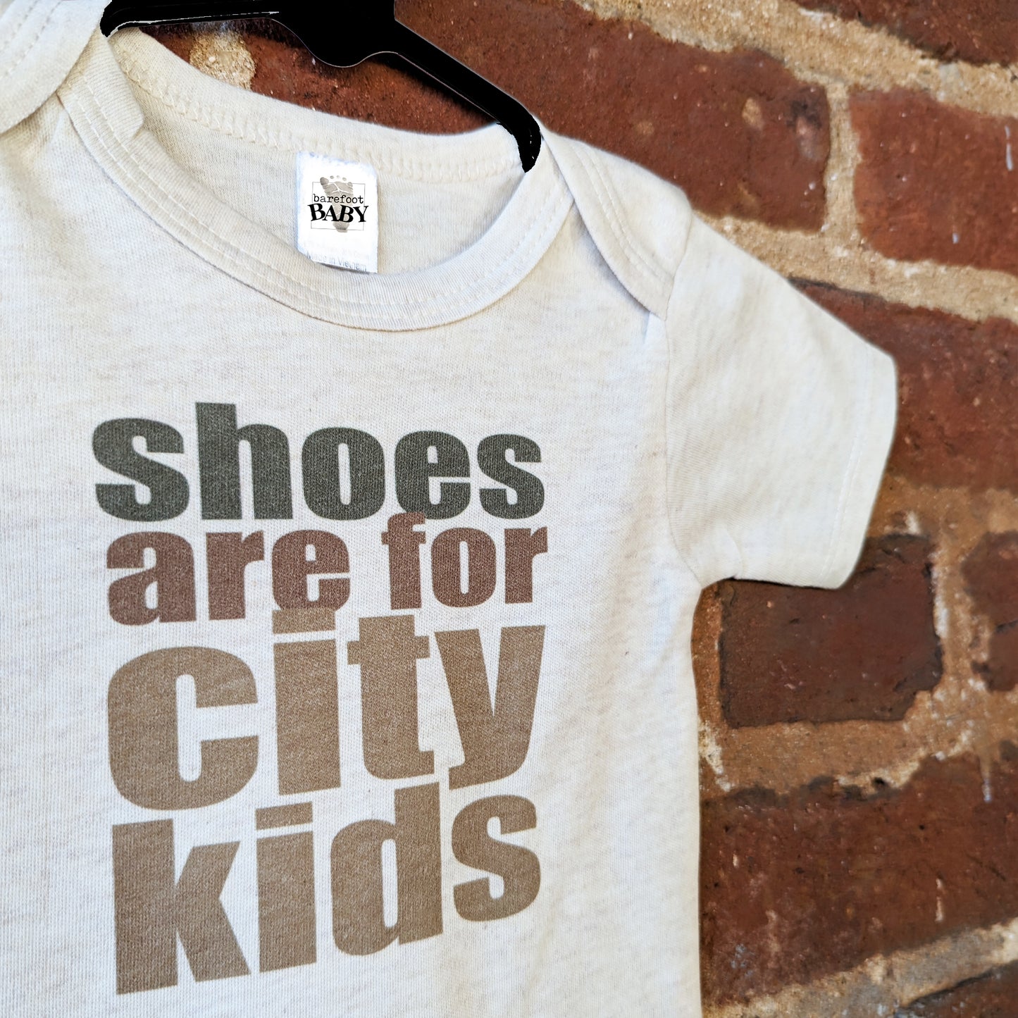 "Shoes are for city kids" Unisex Baby Body suit