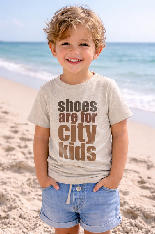 "Shoes are for city kids" Unisex Barefoot Baby tee