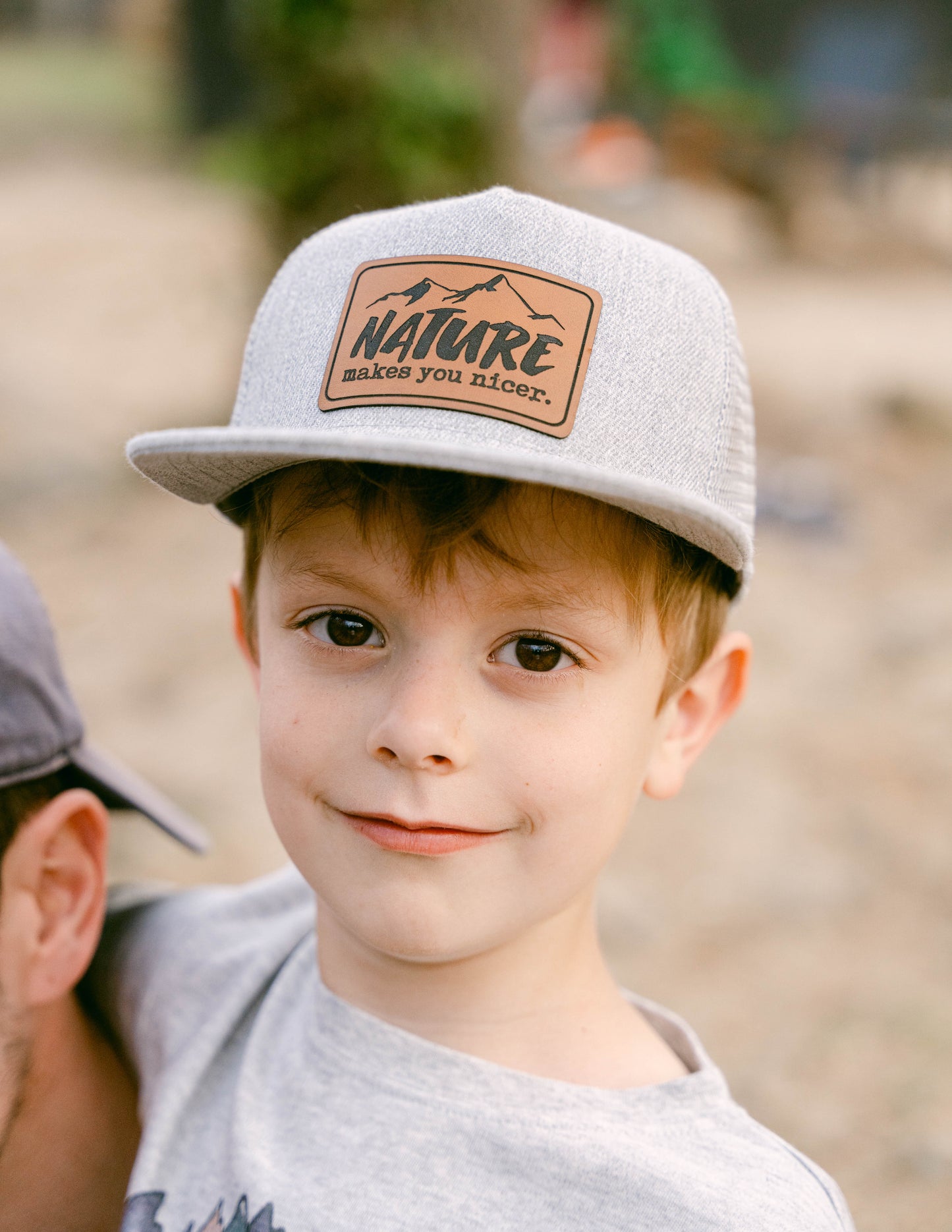 "Nature Makes you Nicer" Trucker Hat | FOUR Color