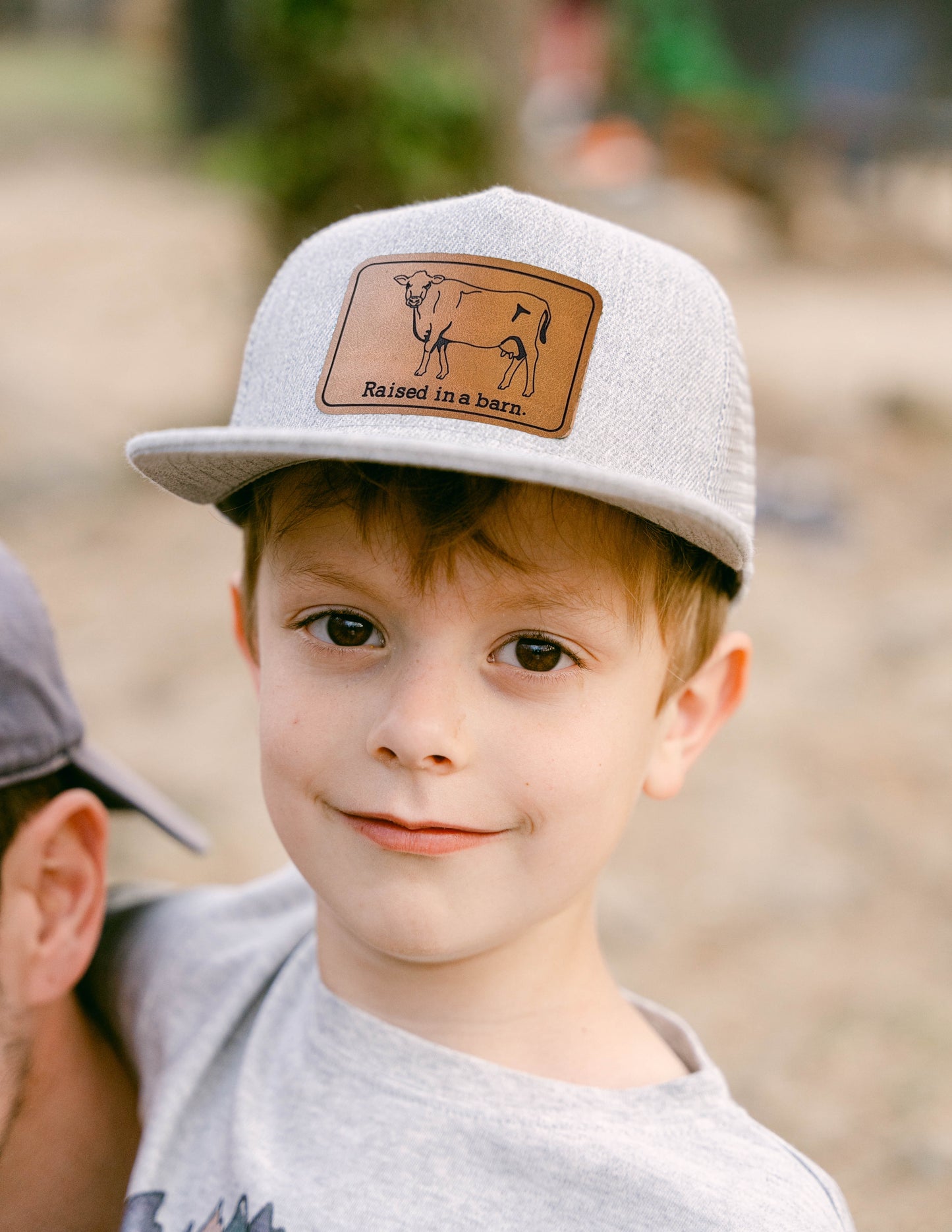 "Raised in a barn" Cow Trucker Hat | FOUR Color Options