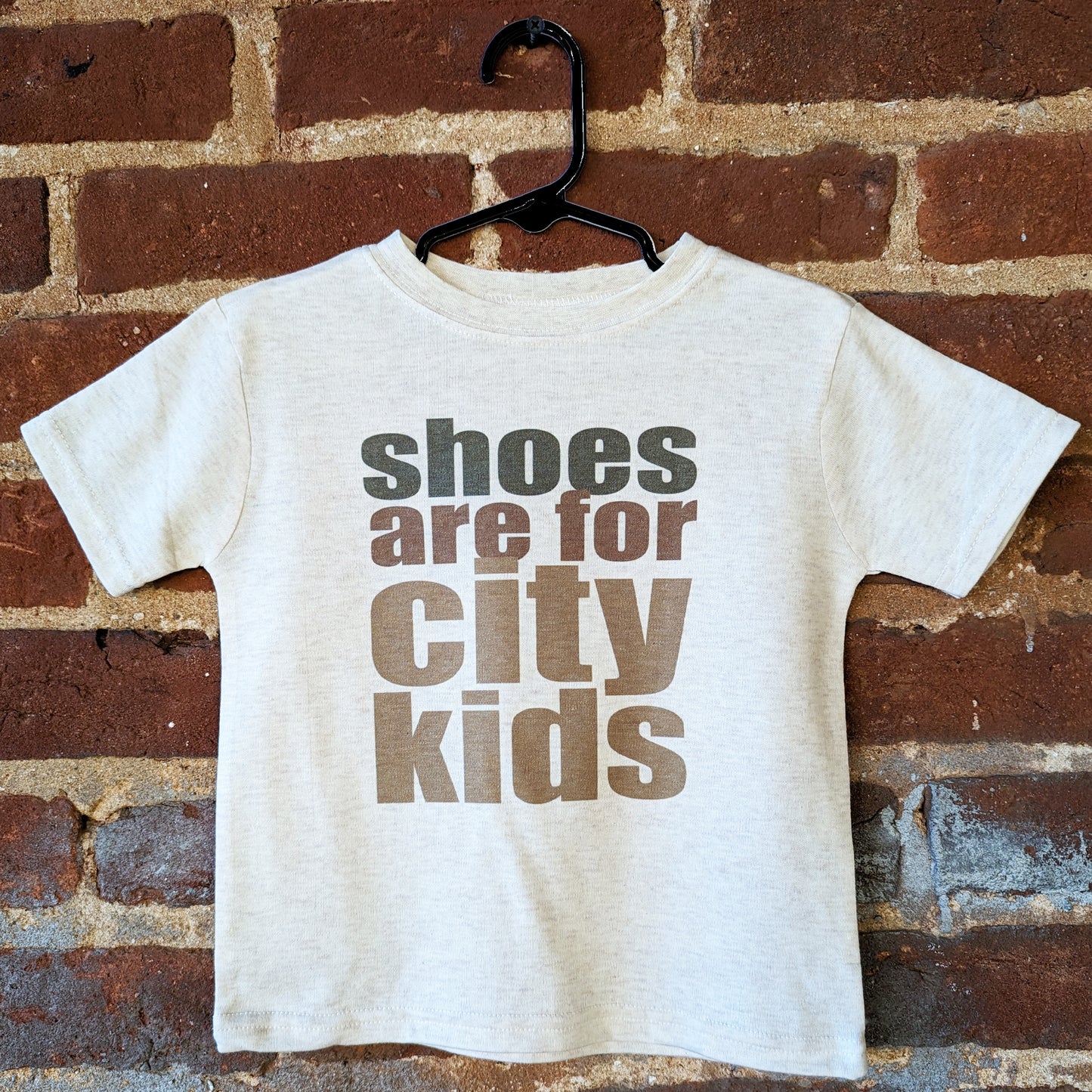 "Shoes are for city kids" Unisex Barefoot Baby tee