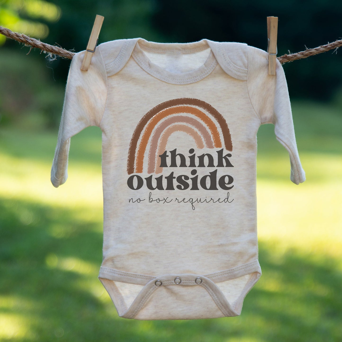 "Think outside no box required" Neutral Rainbow body suit