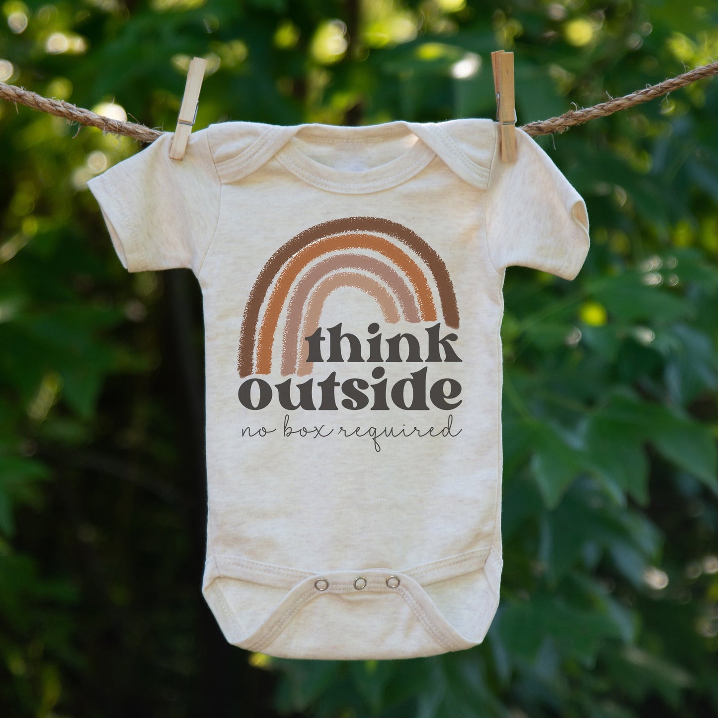 "Think outside no box required" Neutral Rainbow body suit